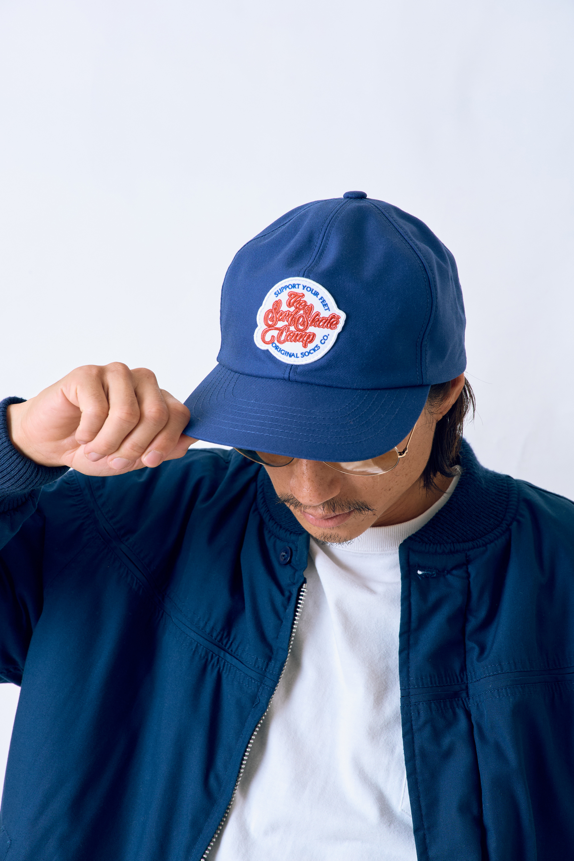 SURFSKATECAMP ORIGINAL LOGO TRUCKER CAP Navy